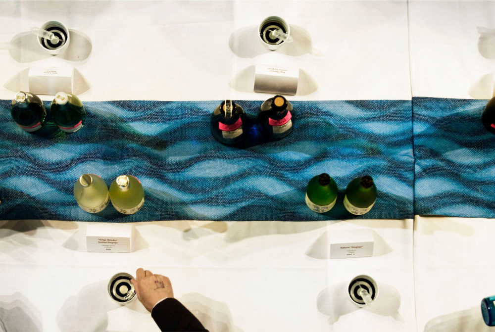 jos08ny128 View from above of sake bottles on Indigo and light blue table runner (2008 New York)