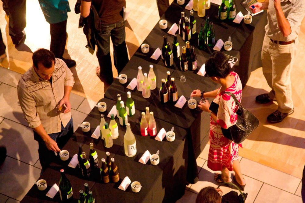 jos08sf051-SL View from above of people sampling sake (2008 San Francisco)